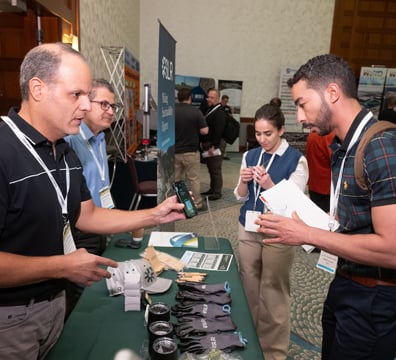 Sponsors handing out resources at their tabletop