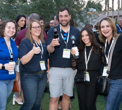 5 attendees posing for a photo at the GWMS Welcome Reception