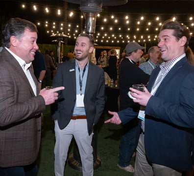 3 attendees networking at the GWMS Welcome Party