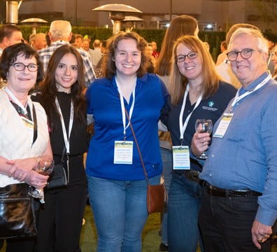 Attendees posing for a photo at the Welcome Reception