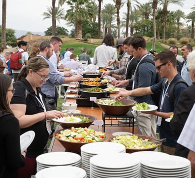 Attendees getting food at the GWMS Welcome Reception