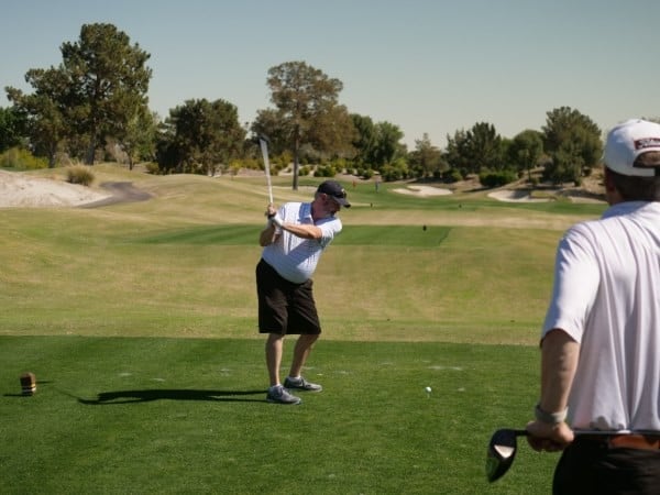 Golfer teeing off at the GWMS Golf Outing